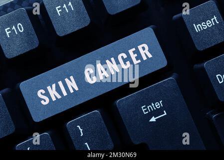 Segno di testo che mostra il cancro della pelle. Parola per la crescita incontrollata di cellule cutanee anormali a causa dell'esposizione al sole Foto Stock