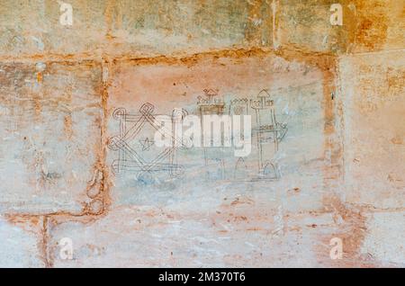 Inscriptions and drawings on the stone wall. The San Millán Suso Monastery was founded by San Millán in the 6th century. The monastery consists of her Stock Photo