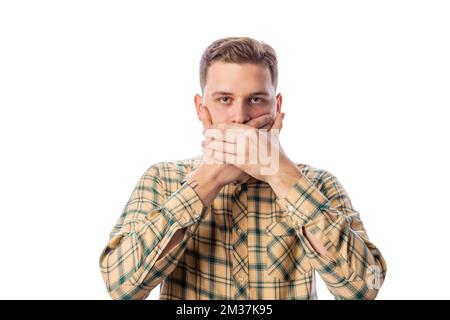 Uomo che chiude la bocca Foto Stock