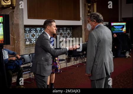 Actor And Author Ben McKenzie Schenkkan, left, is greeted by United States Senator Sherrod Brown (Democrat of Ohio), Chairman, US Senate Committee on Banking, Housing, and Urban Affairs as he arrives for a Senate Committee on Banking, Housing, and Urban Affairs hearing to examine why the FTX bubble burst and the harm to consumers, in the Dirksen Senate Office Building in Washington, DC, Wednesday, December 14, 2022. Credit: Rod Lamkey/CNP /MediaPunch Stock Photo