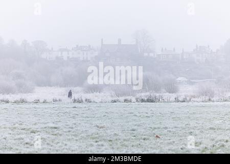 Chester, UK. 12th Dec, 2022. A lone walker makes her way through the Meadows that have been transformed into a winter wonderfalnd in Chester, UK. Credit: Simon Hyde/Alamy Live News. Stock Photo