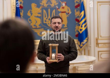 Kyiv, Ukraine. 14th Dec, 2022. Ukrainian Plast National Scout members present President Volodymyr Zelenskyy, with the Peace Light of Bethlehem during a visit to the Mariyinsky Palace, December 14, 2022 in Kyiv, Ukraine. Credit: Ukraine Presidency/Ukrainian Presidential Press Office/Alamy Live News Stock Photo