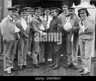 Caporale C. A. Jarvis VC (1881-1948), metalmeccanico scozzese e ingegnere che fu il primo soldato volontario della prima guerra mondiale a ricevere la Croce Vittoria. Solo tre settimane in guerra il 23 agosto 1914 a Jemappes, Belgio, Lance-Corporal Jarvis lavorò per 1½ ore sotto fuoco pesante, in piena vista del nemico e finalmente riuscì a sparare accuse per la demolizione di un ponte. È stato ferito nel processo. Nella foto si incontra uomini feriti a Chelmsford, dove ha tenuto un "discorso di reclutamento di capitali”. Data: 1915 Foto Stock