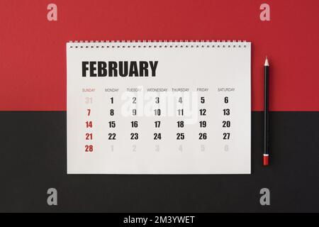 Calendario piano lay planner sfondo rosso nero Foto Stock