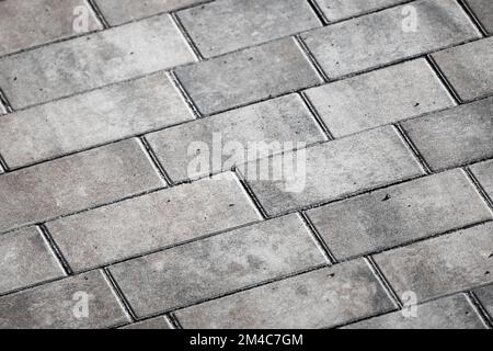 Fondo stradale in cemento grigio, pavimentazione in lastre Foto Stock