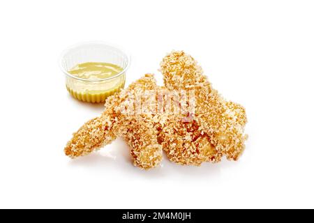 Strisce di pollo fritte in croccante breading con salsa di formaggio Foto Stock