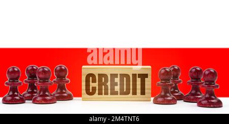 Concetto nazionale. Sullo sfondo della bandiera di Polonia pedine e un segno con l'iscrizione - credito Foto Stock