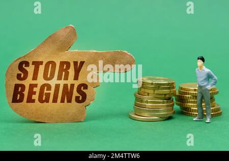 Business e concetto di economia. Sulla superficie verde della moneta e una figura di un uomo, sono indicati da un segno - una mano con l'iscrizione - Sto Foto Stock