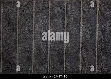 Tessuto grigio di panno in microfibra di cotone. Panno in spugna grigio con texture visibile e spazio di copia per il testo. Primo piano di tessuto di cotone naturale chiaro opaco Foto Stock