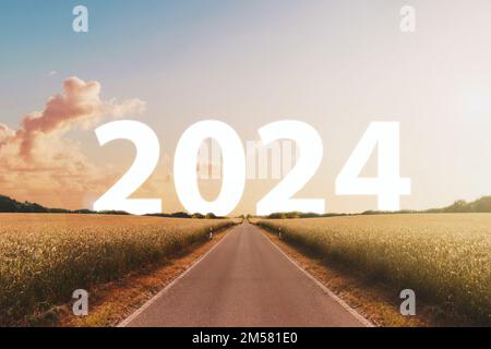 Felice nuovo anno 2024 concetto - strada o autostrada con testo Foto Stock