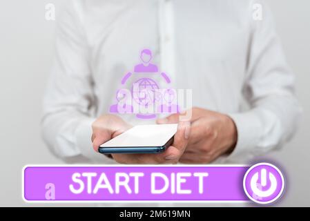 Segno che visualizza Start Diet (Avvia dieta). Parola per cibo di corso speciale a cui la persona si limita Foto Stock