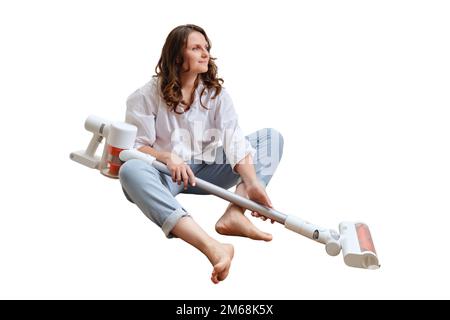 Donna che aspira mobili in una casa con un aspirapolvere portatile  portatile portatile Foto stock - Alamy