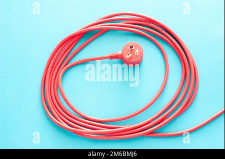 Cavo elettrico rosso a spirale o cavo con spina Foto Stock