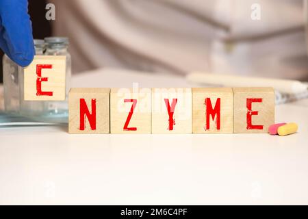 Parola DI ENZIMA fatta con i blocchi di costruzione. Foto Stock