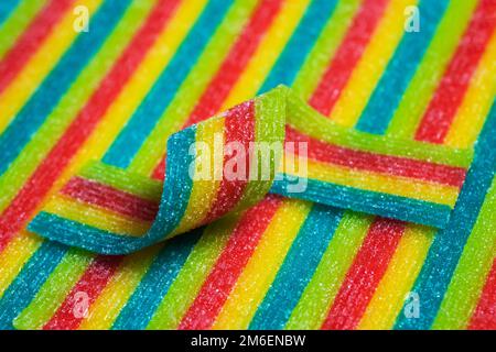 Caramelle arcobaleno di gelatina acidata strisce in zucchero spruzzare Foto  stock - Alamy