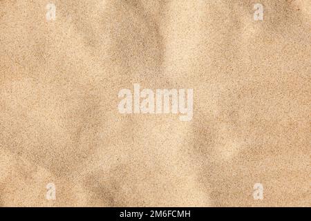 Sabbia sullo sfondo della spiaggia Foto Stock