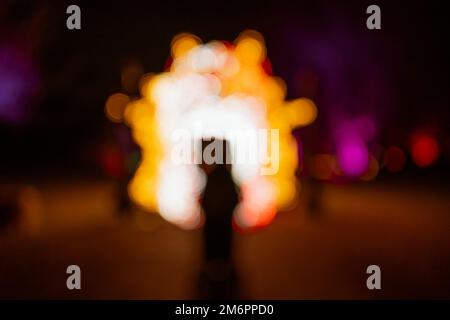 Bokeh luci nel buio astratto sfondo Foto Stock