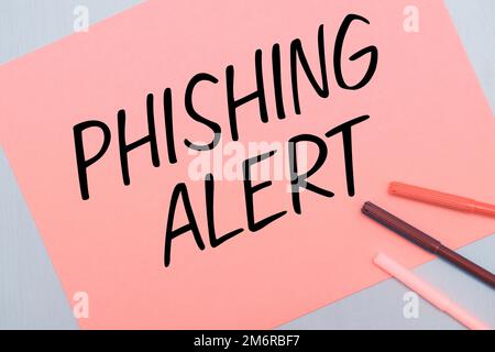 Segno di scrittura a mano Phishing Alert. Vetrina aziendale consapevole del tentativo fraudolento di ottenere informazioni sensibili Foto Stock