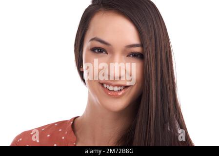 Sorridere...la positività è infettiva. Ritratto di una bella giovane donna isolata su bianco. Foto Stock