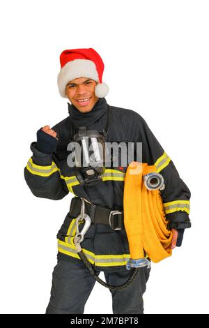 Sorridente pugno vigile del fuoco durante Natale Foto Stock
