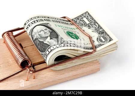 Banconote in dollari in una trappola di mousetrap, dept, USA Foto Stock