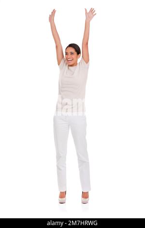 Pieno di gioia esuberante. Una donna felice che festeggia con le braccia alzate. Foto Stock
