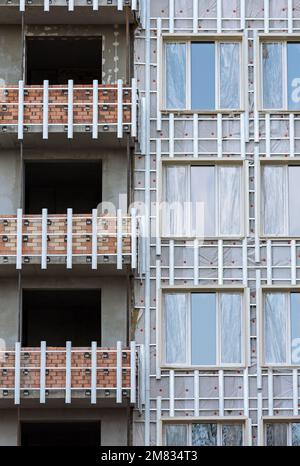 isolamento termico esterno della casa con lana minerale. edificio in costruzione. Foto Stock