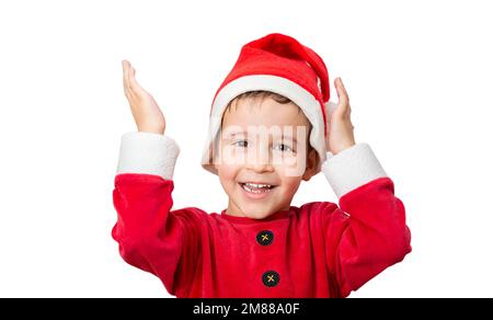 Studio shot di un bambino allegro in posa in un cappello di santa mentre si trova su uno sfondo bianco Foto Stock