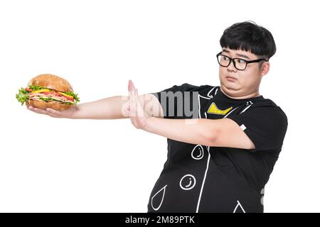 Giovani uomini che trasportano obesità alimentare Foto Stock