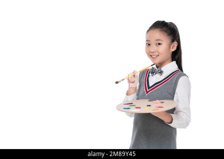 Gli allievi felici prendono la palette Foto Stock