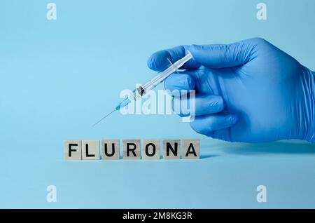 Flurona - COVID e influenza allo stesso tempo. Una nuova malattia nel mondo. Concetto medico Foto Stock