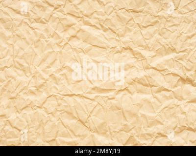 Grana carta extra morbida beige o gialla stropicciata. Pagina o foglio di grunge bianco per la decorazione di interni ed esterni. Sfondo vuoto per artigianato Foto Stock