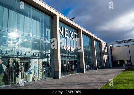 Segnaletica esterna del negozio di abbigliamento e casalinghi Next nel centro commerciale Merry Hill Foto Stock