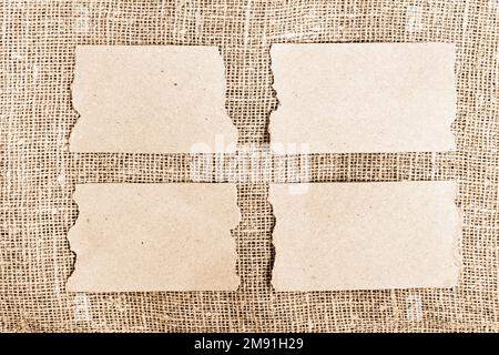 Set di carta da artigianato con bordi strappati su fondo tela Foto Stock