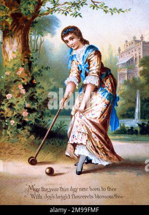Carta vittoriana di compleanno in seta, Donna che gioca a croquet. Foto Stock