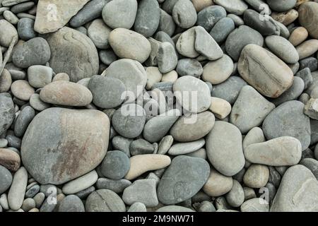 uno sfondo roccioso di spiaggia testurizzato Foto Stock