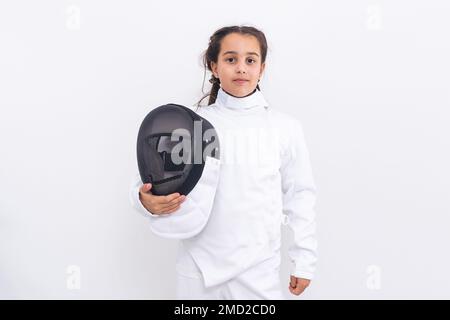 bambina in un vestito di scherma Foto Stock