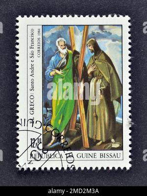 Francobollo annullato stampato dalla Guinea Bissau, che mostra pittura St. Andrew e St. Francis, El Greco, Mostra Filatelica Mondiale - Spagna 84, ci Foto Stock
