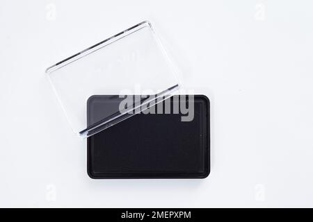 Tampone nero con coperchio in plastica, primo piano Foto Stock