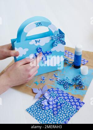 Creare una borsa, fissare le forme a farfalla Foto Stock
