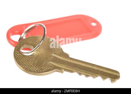 Un tasto con un'etichetta rossa sul bianco Foto Stock