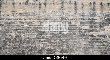 pietra di mattoni vecchio intonaco grunge facciata carta da parati in cemento sfondo muro Foto Stock