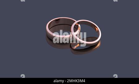 3D render - due anelli dorati di nozze giacciono su una superficie scura dello specchio. Foto Stock