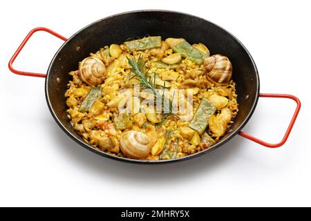 Paella Valenciana (piatto di riso tradizionale spagnolo); coniglio, pollo, fagioli al garofone, lumache, Fagioli verdi marocchini, zafferano e riso bomba. Foto Stock