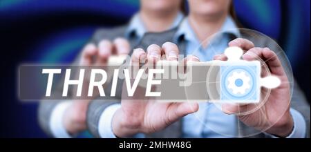 Segno che mostra THRIVE. Concetto di Internet pensare positivamente continuare a prosperare e fiorire il tempo di fiorire Foto Stock