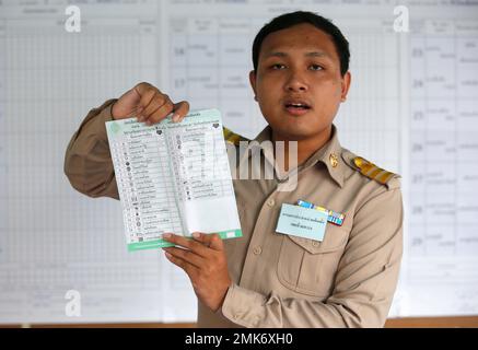 In this Sunday, March 24, 2019, photo, a Thai officer count ballot after close polling station n Bangkok, Thailand. Thai election authorities have ordered a recount of votes and new elections in some polling areas after finding irregularities in last month’s elections. Thailand’s Election Commission said in a statement Thursday, April 4, that it had ordered a recount in two polling stations and new elections in six polling stations due to the number of voters not matching the number of ballots in the March 24 general elections.(AP Photo/Sakchai Lalit)