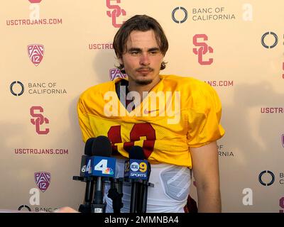 Southern California quarterback J.T. Daniels listens to reporters following his first NCAA college football practice after winning the Trojans' starting job, Tuesday, Aug. 28, 2018, in Los Angeles. The 18-year-old Daniels will be the first true freshman to start at quarterback for USC's powerhouse program since 2009. (AP Photo/Greg Beacham)