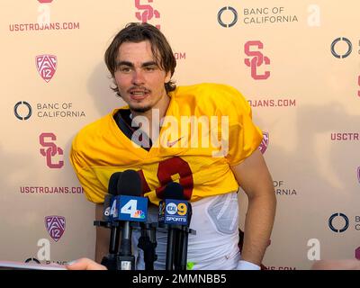Southern California quarterback J.T. Daniels speaks to reporters following his first NCAA college football practice after winning the Trojans' starting job, Tuesday, Aug. 28, 2018, in Los Angeles. The 18-year-old Daniels will be the first true freshman to start at quarterback for USC's powerhouse program since 2009. (AP Photo/Greg Beacham)