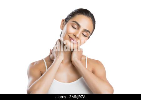 Ritratto di giovane donna che fa massaggio al collo Foto Stock