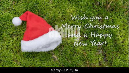 Biglietto di Natale babbo Natale e testo in inglese: Vi auguro buon Natale e buon anno Foto Stock